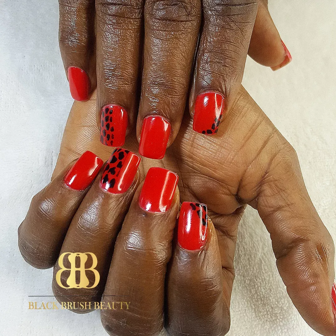 Classic red with black spotted accent nails