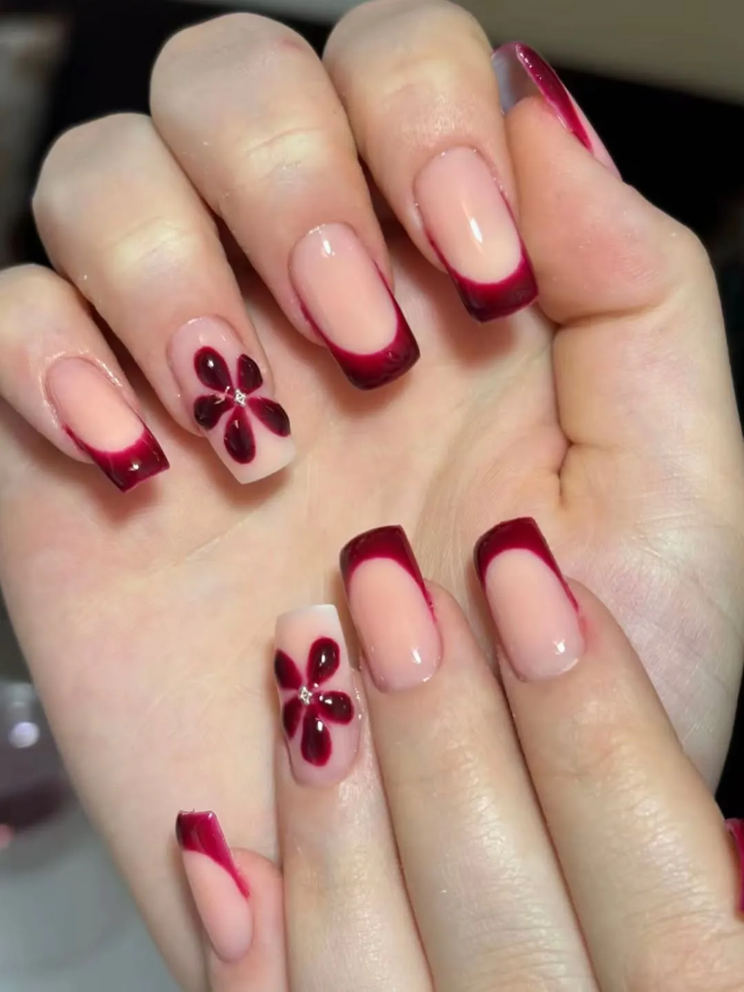 Burgundy French Tips with Floral Accents