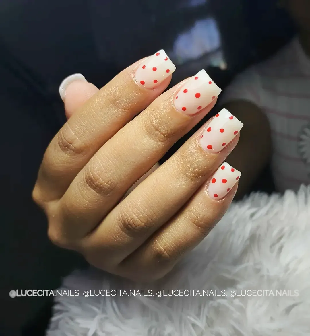 White French tips with red polka dots