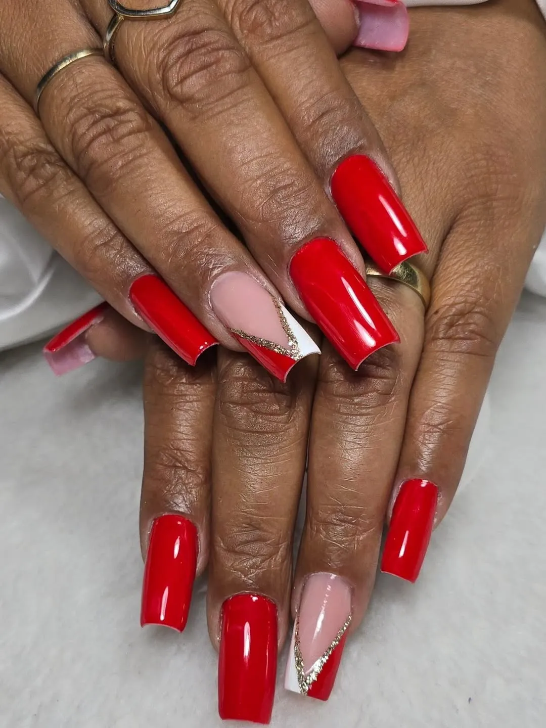 Solid red set with diagonal color-block accent nails