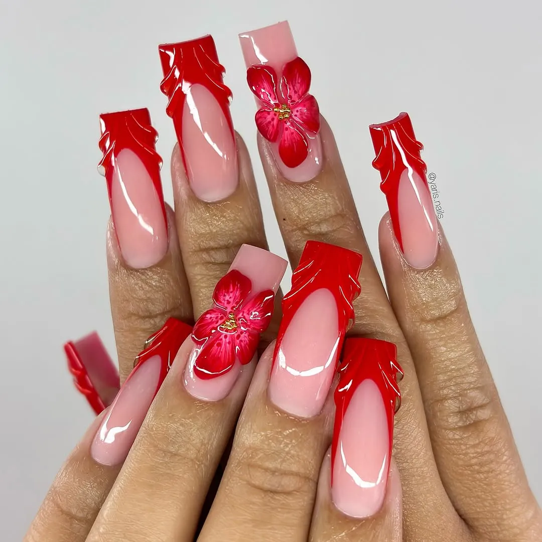 Extra-long red-edged nails with large floral accents