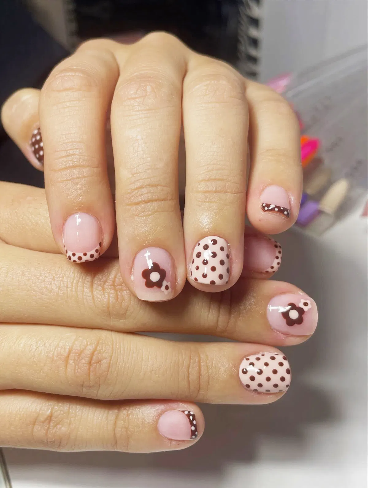 Pink-and-brown polka dots with floral accents