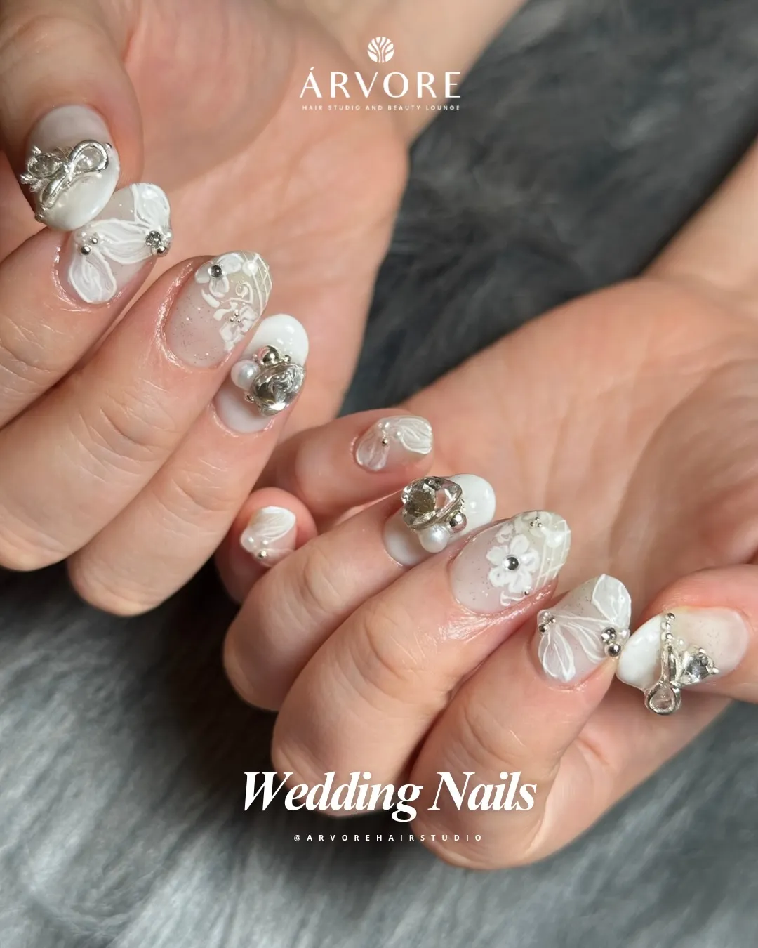 White floral art with prominent 3D charms and pearls