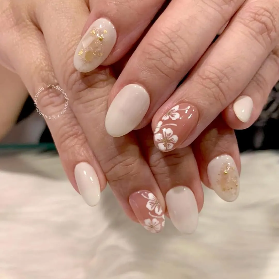 Off-white and nude mix with white florals and gold flecks