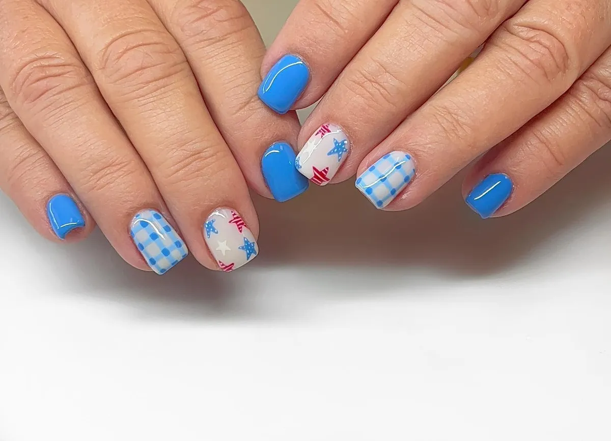 Blue solids with gingham and star accent nails