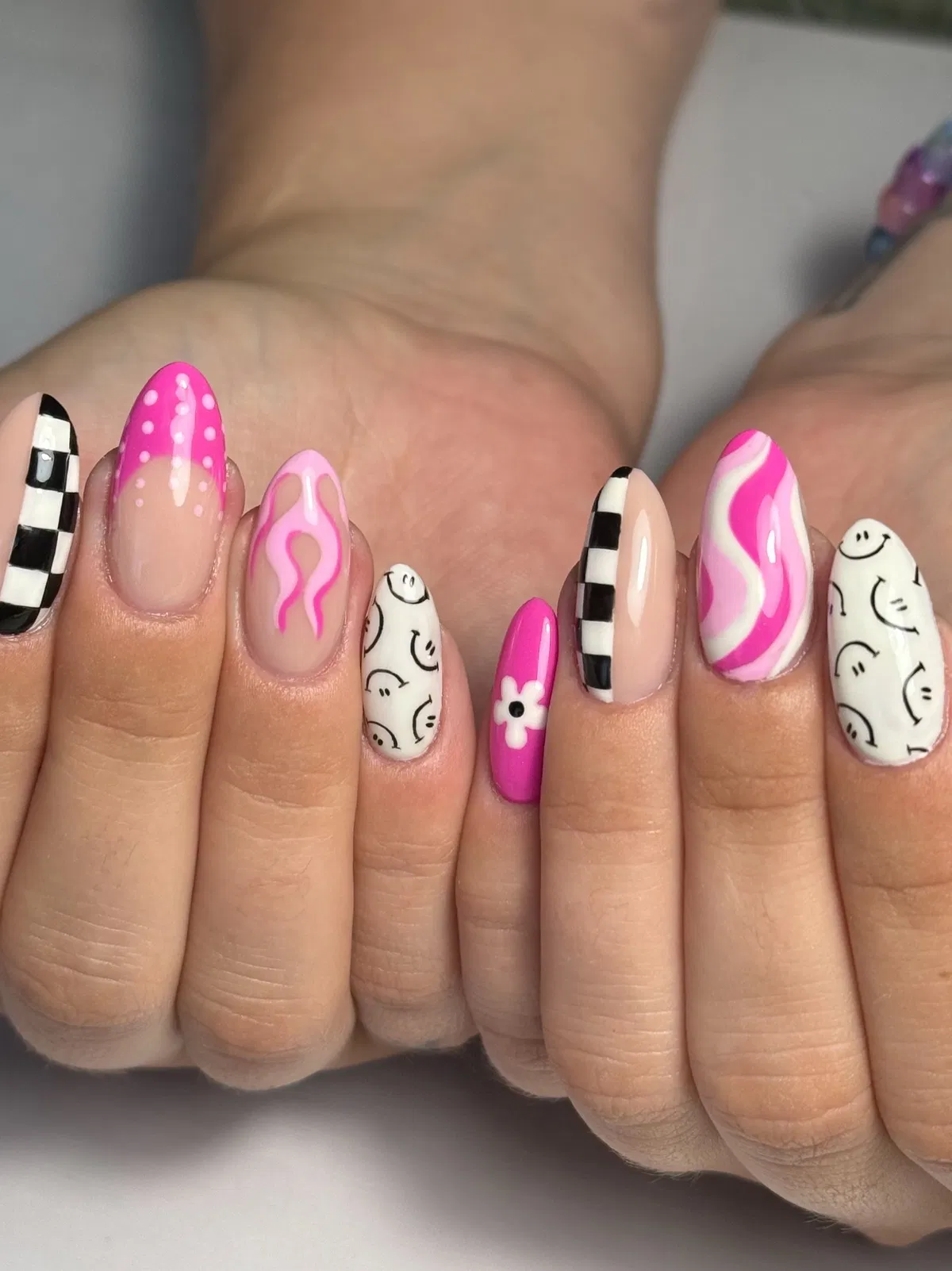 Black-and-white checkers with hot pink swirls