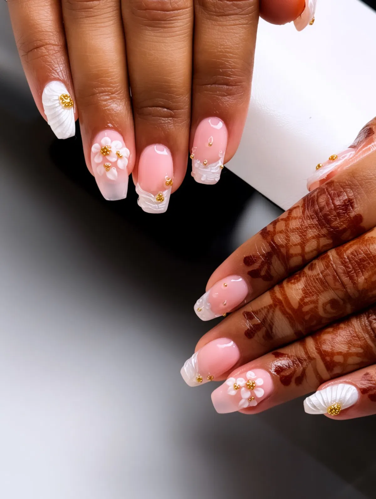 Pink ombrΓ© squares with raised white texture and gold beads