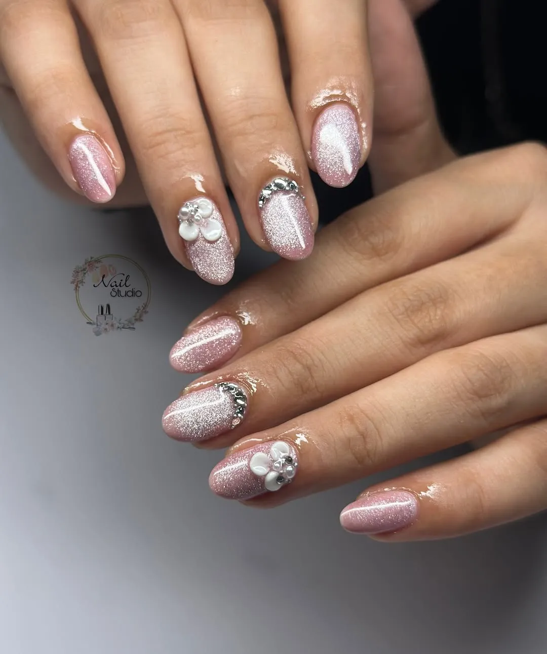 Close-up: rhinestone arcs and 3D floral accents