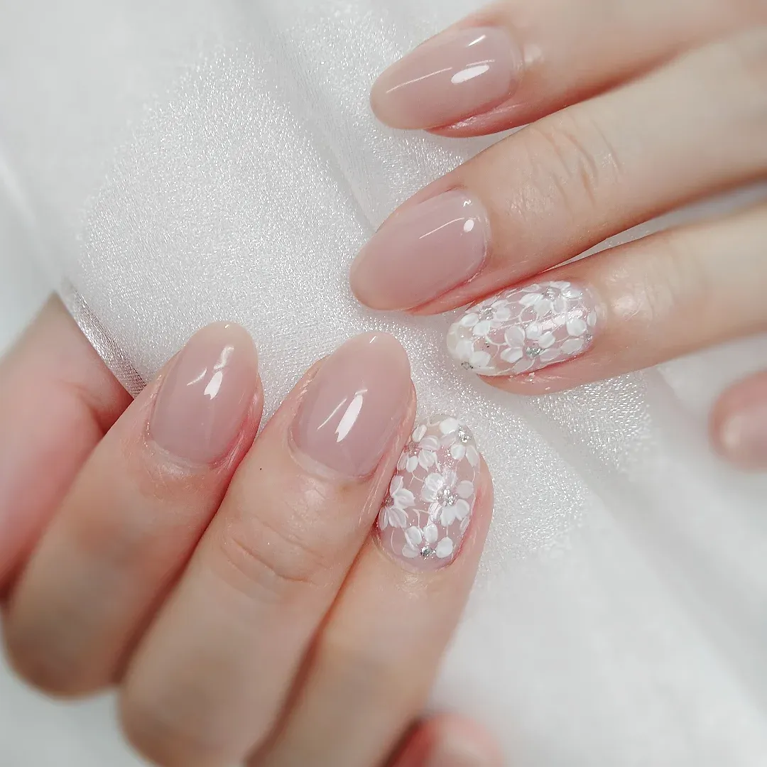 Nude-pink almonds with all-over white floral accents