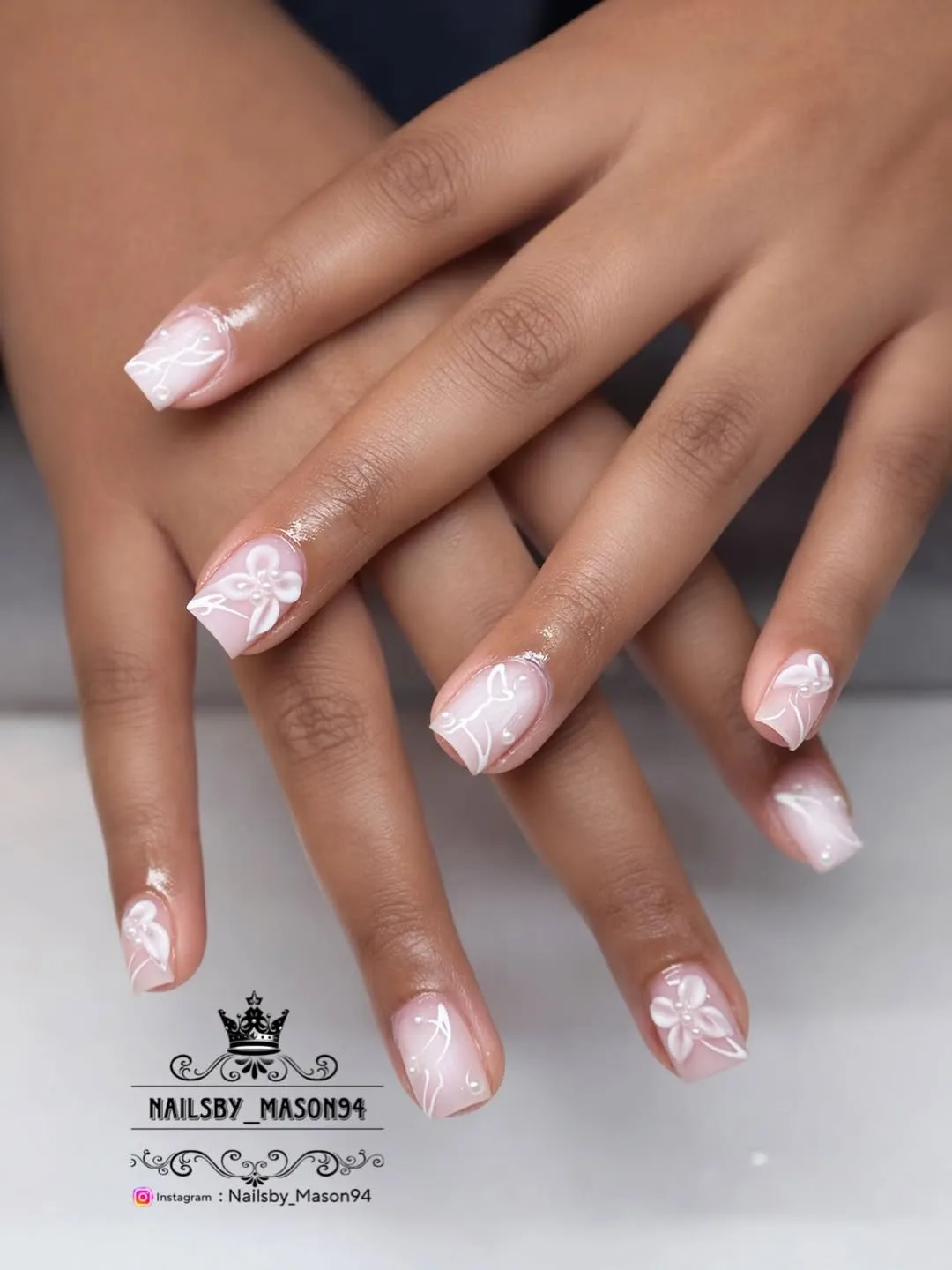 Pale pink squares with white floral linework