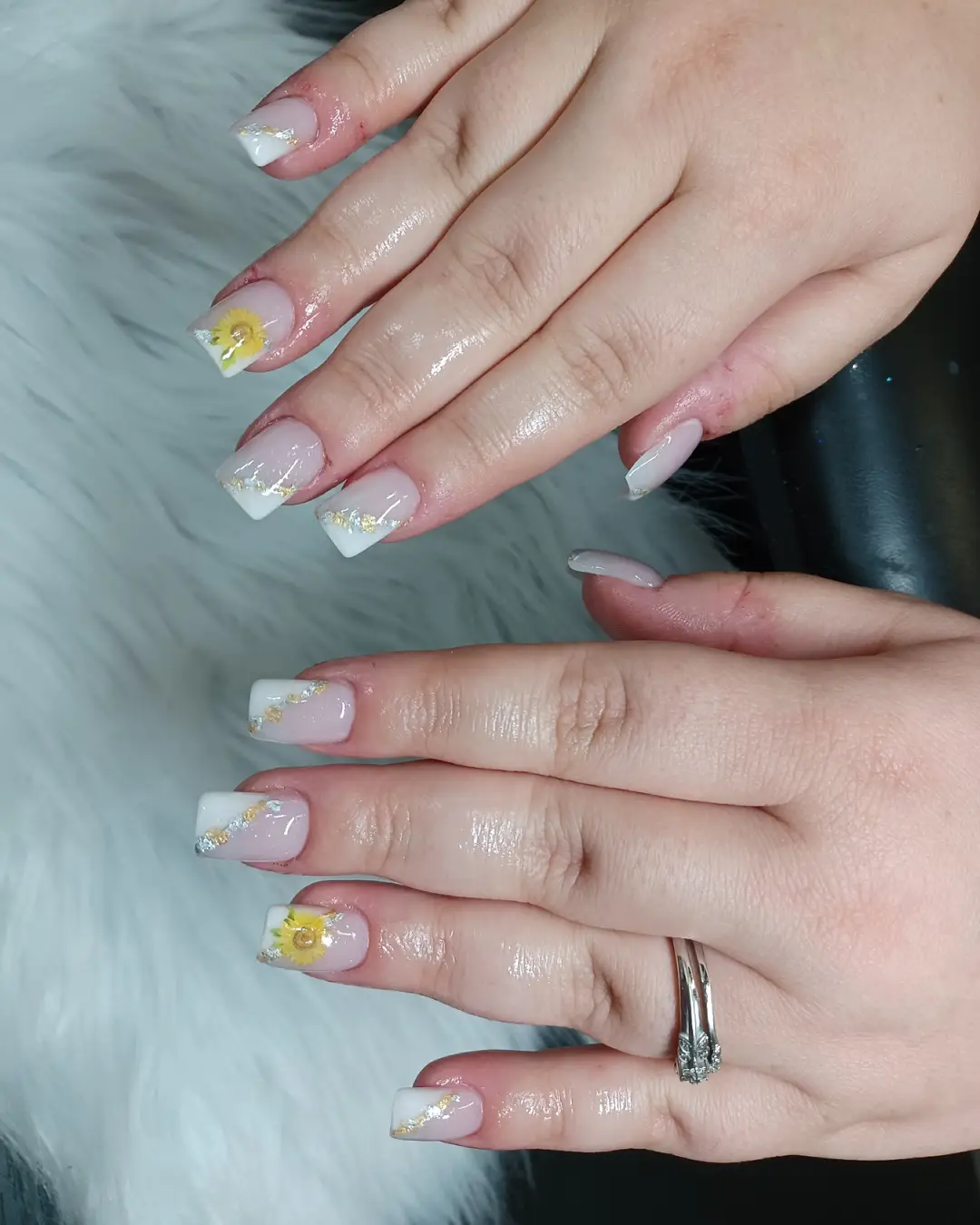 Pink square nails with white tips, metallic accents, and yellow flowers (second view)