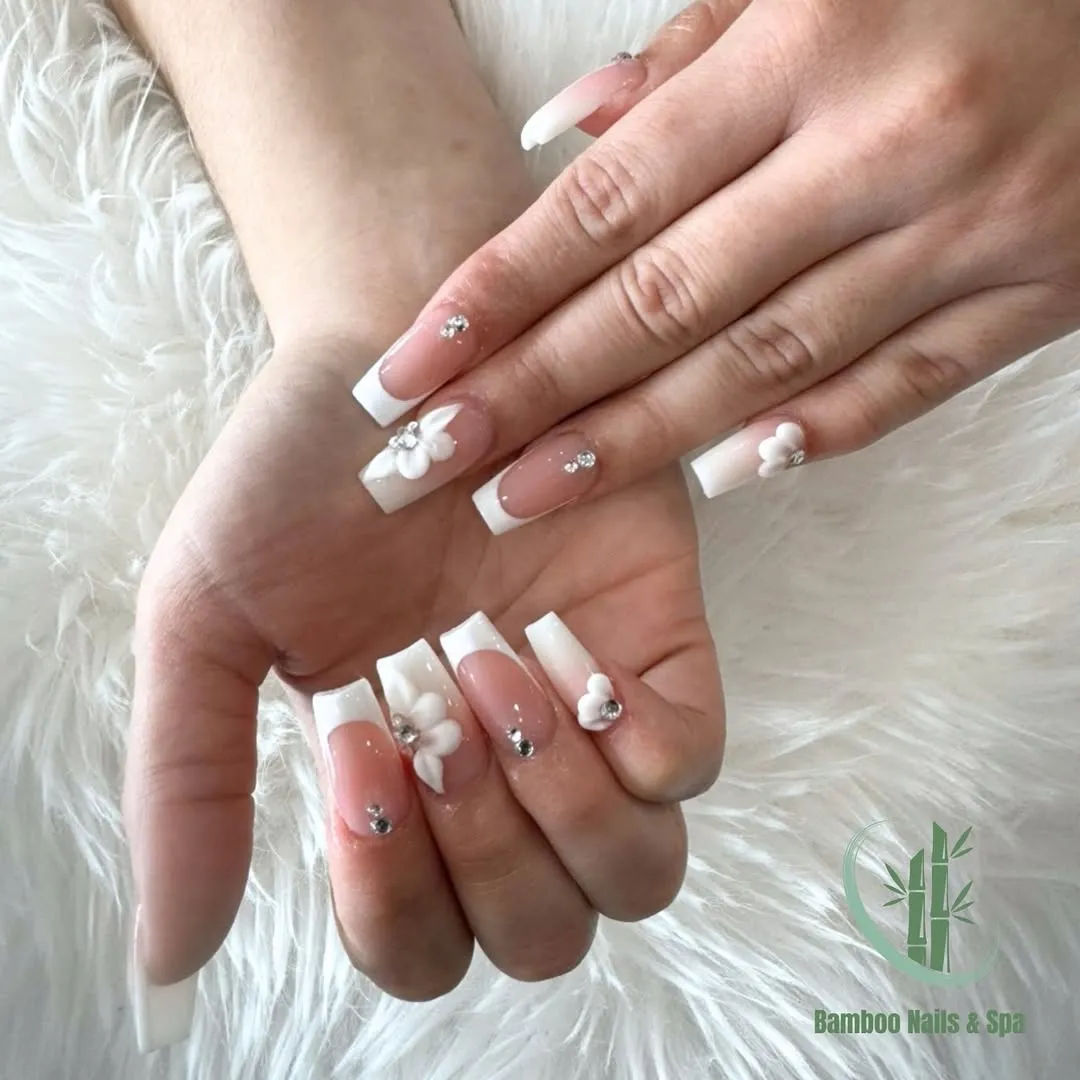 Pink square French tips with 3D flowers (Bamboo Nails & Spa watermark)