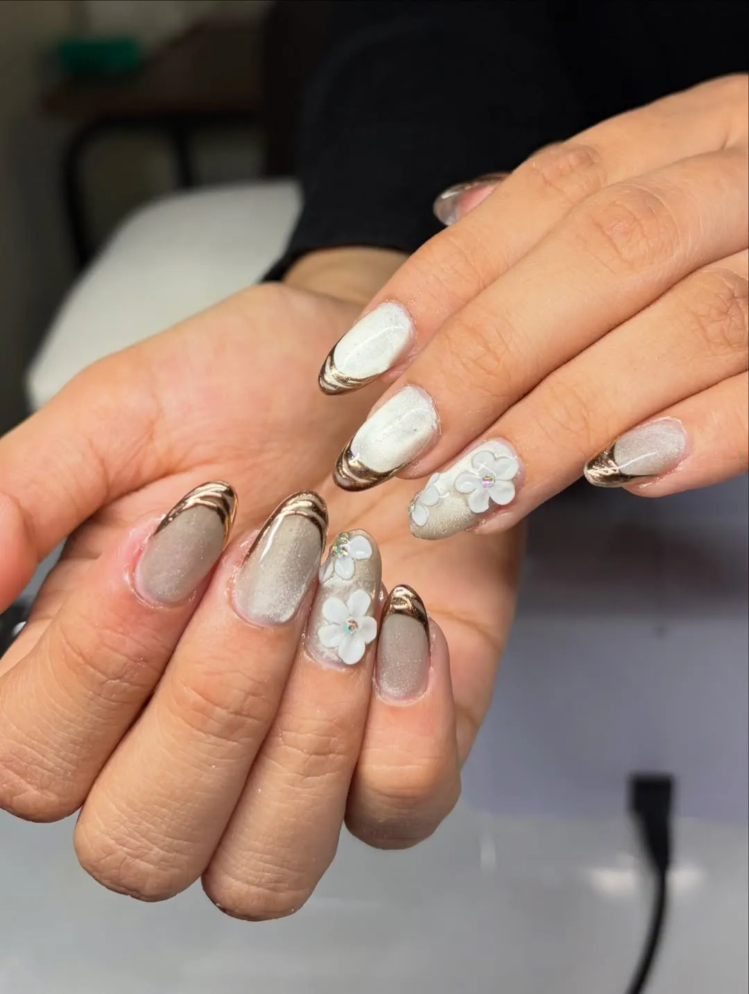 Shimmery gray with metallic curved tips and 3D white flowers
