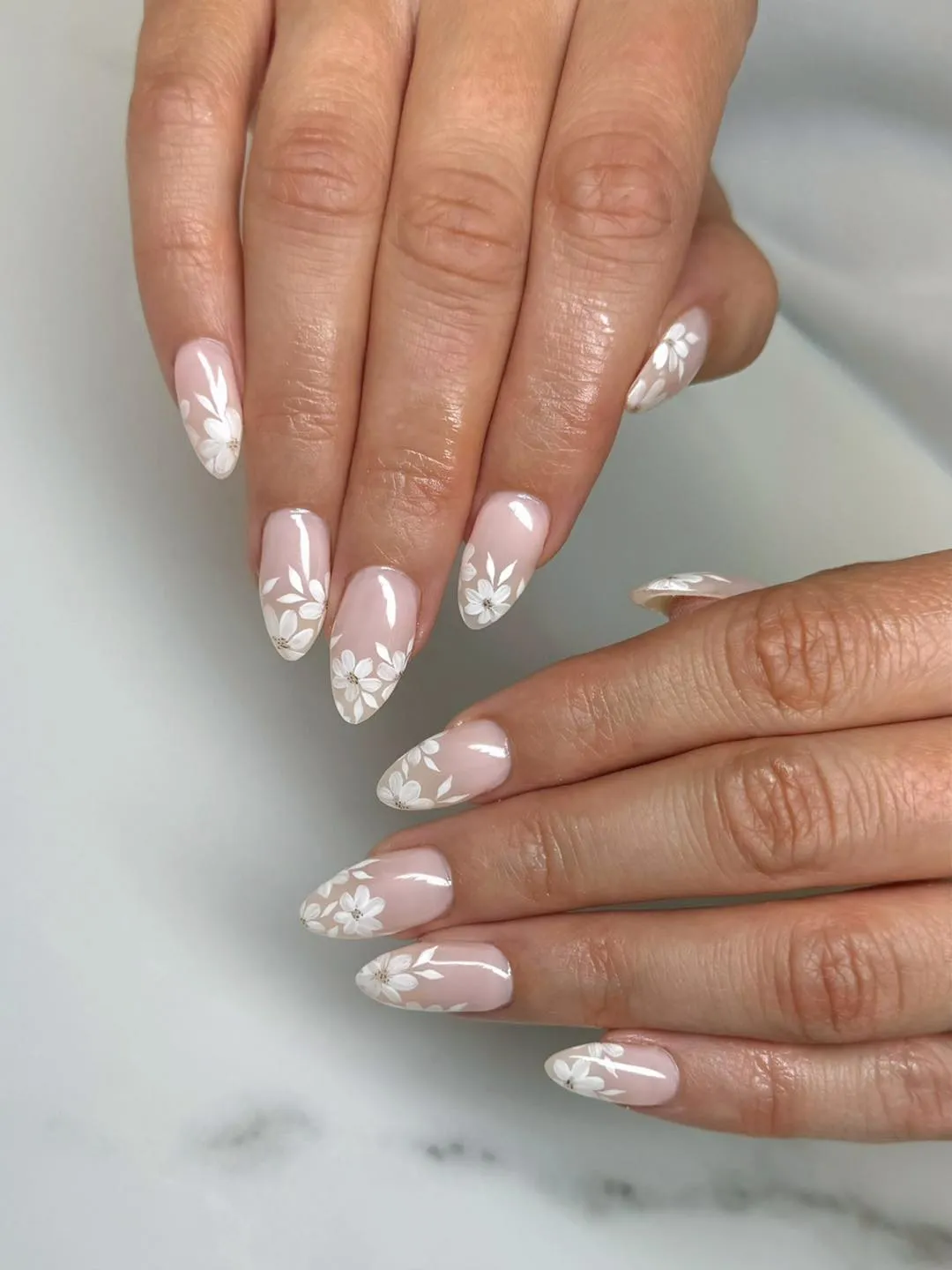 Pale pink base with white floral tip detailing