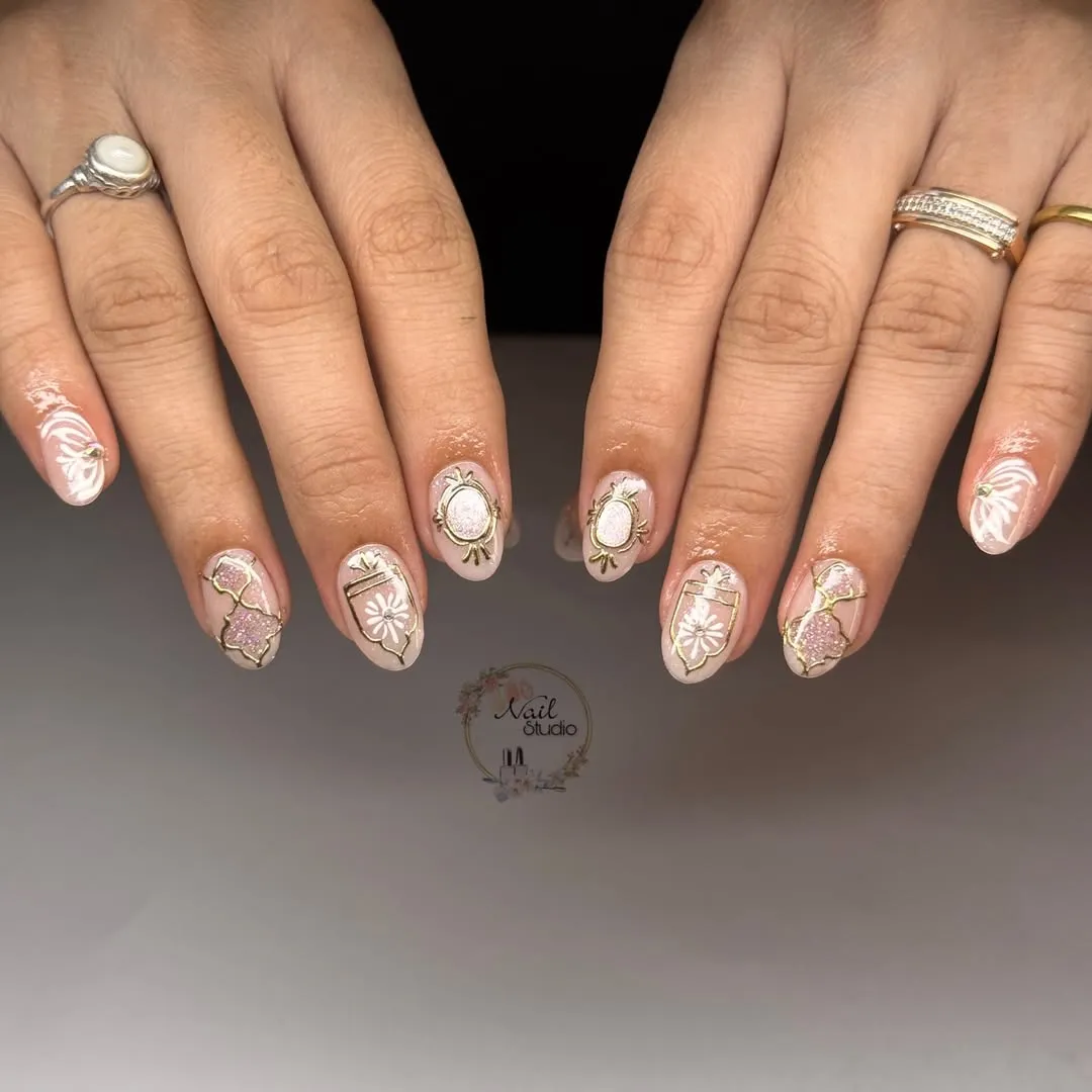Gold outlines with white florals and pink glitter accents