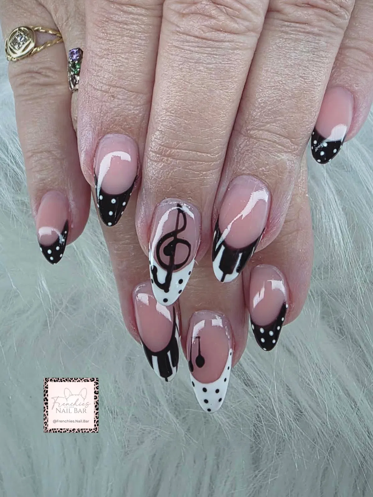 Music-note accents with black-and-white polka dot French tips