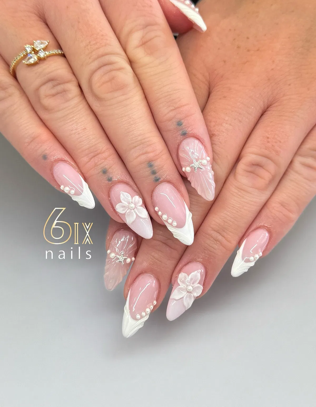 Textured French Tips with 3D Flowers and Rhinestone Accents