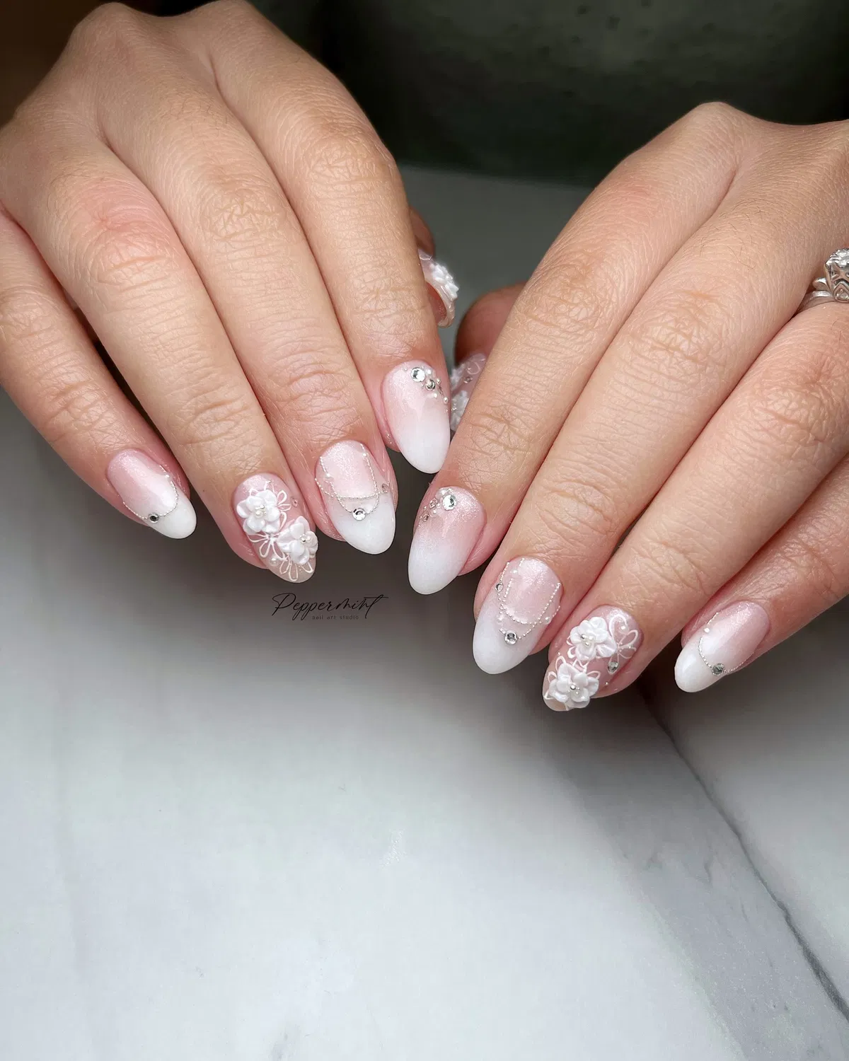 Soft French ombré with 3D floral accents and rhinestones