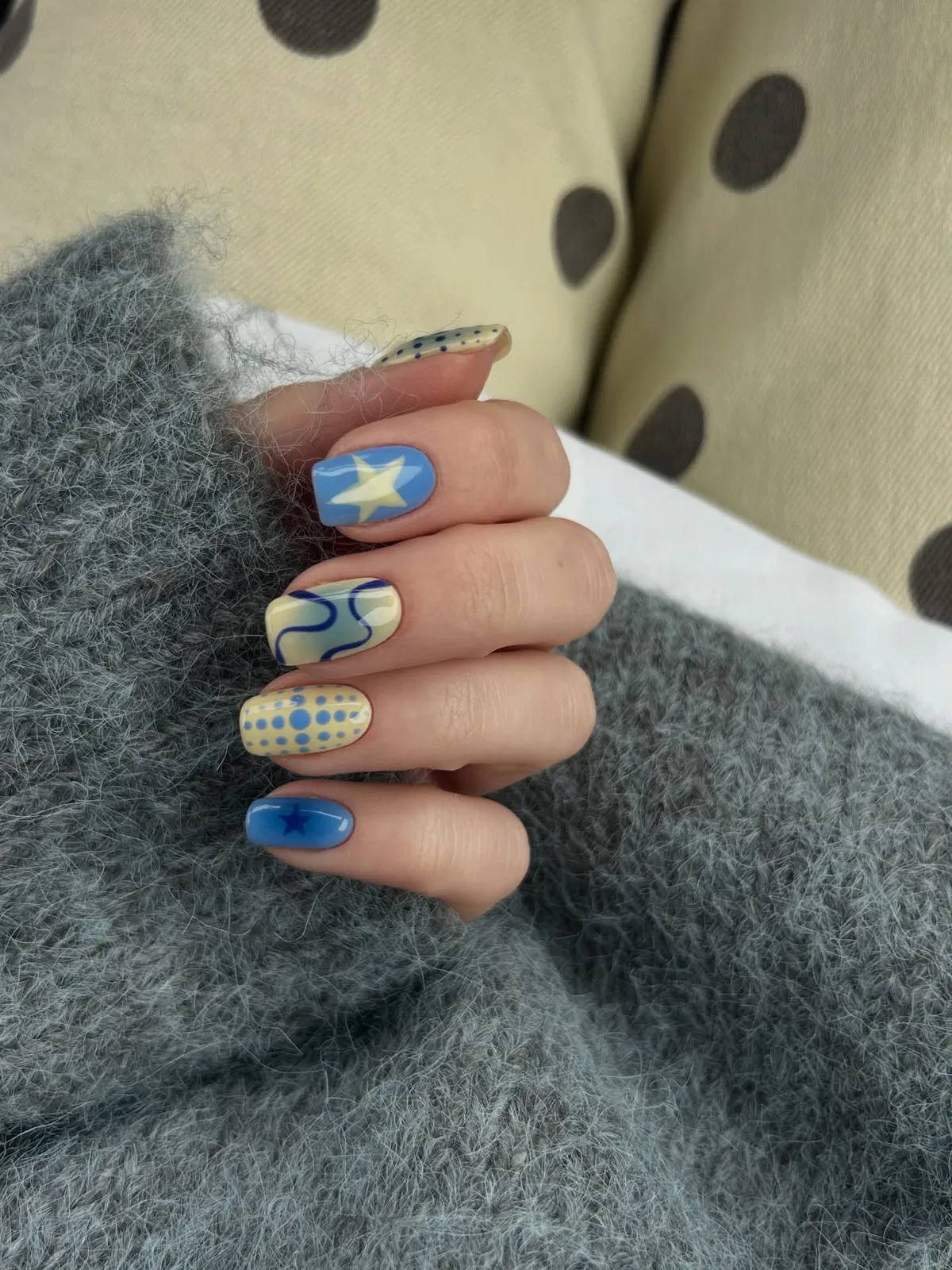 Blue and yellow mix with star accents and dotted nail