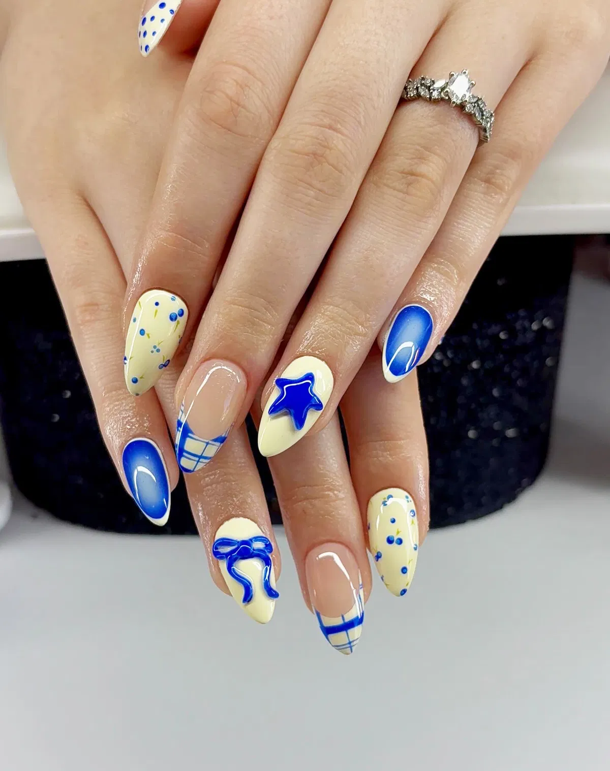 Blue-accent plaid tips with 3D star and bow details