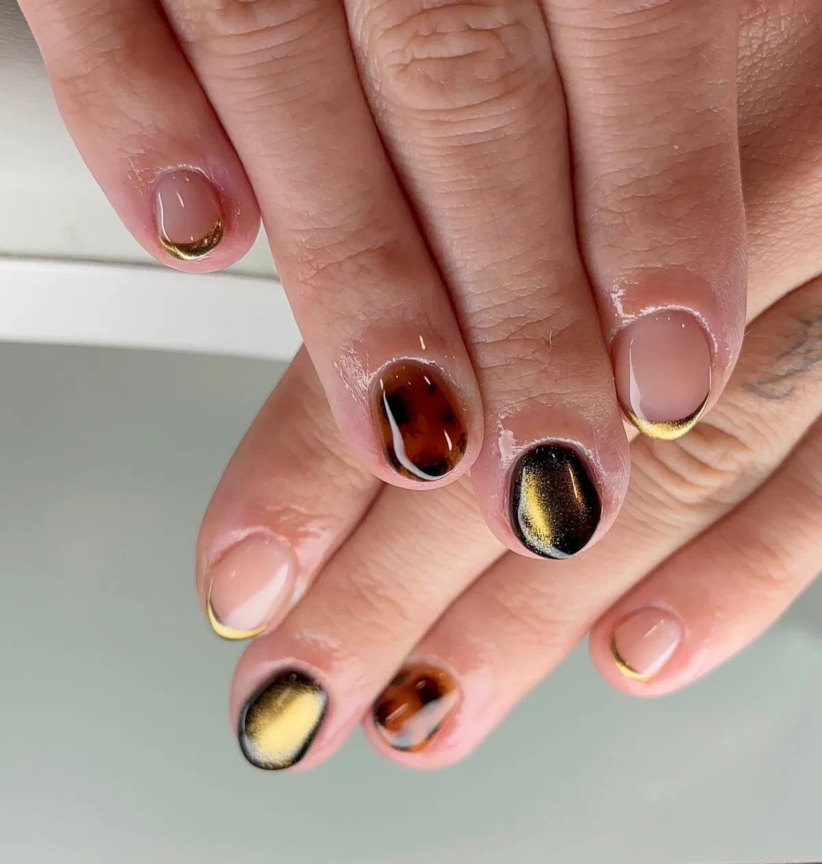 Short nude set with gold half-moons and black-gold accent