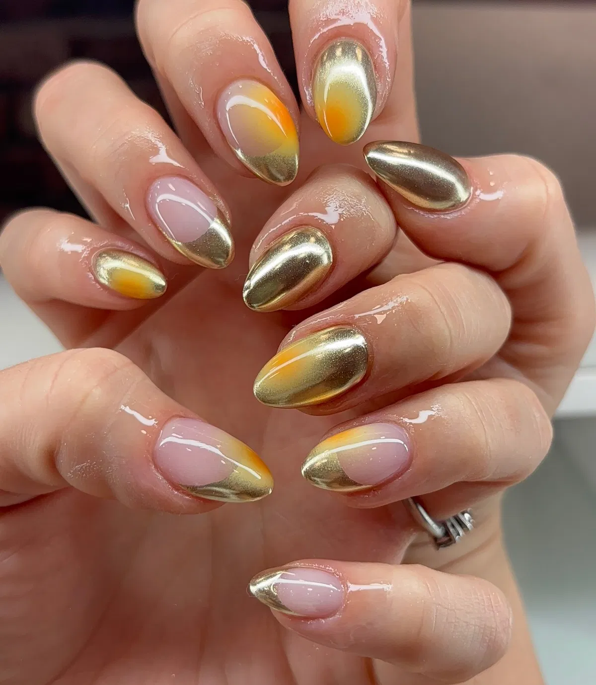 Metallic gold with yellow-orange aura fades