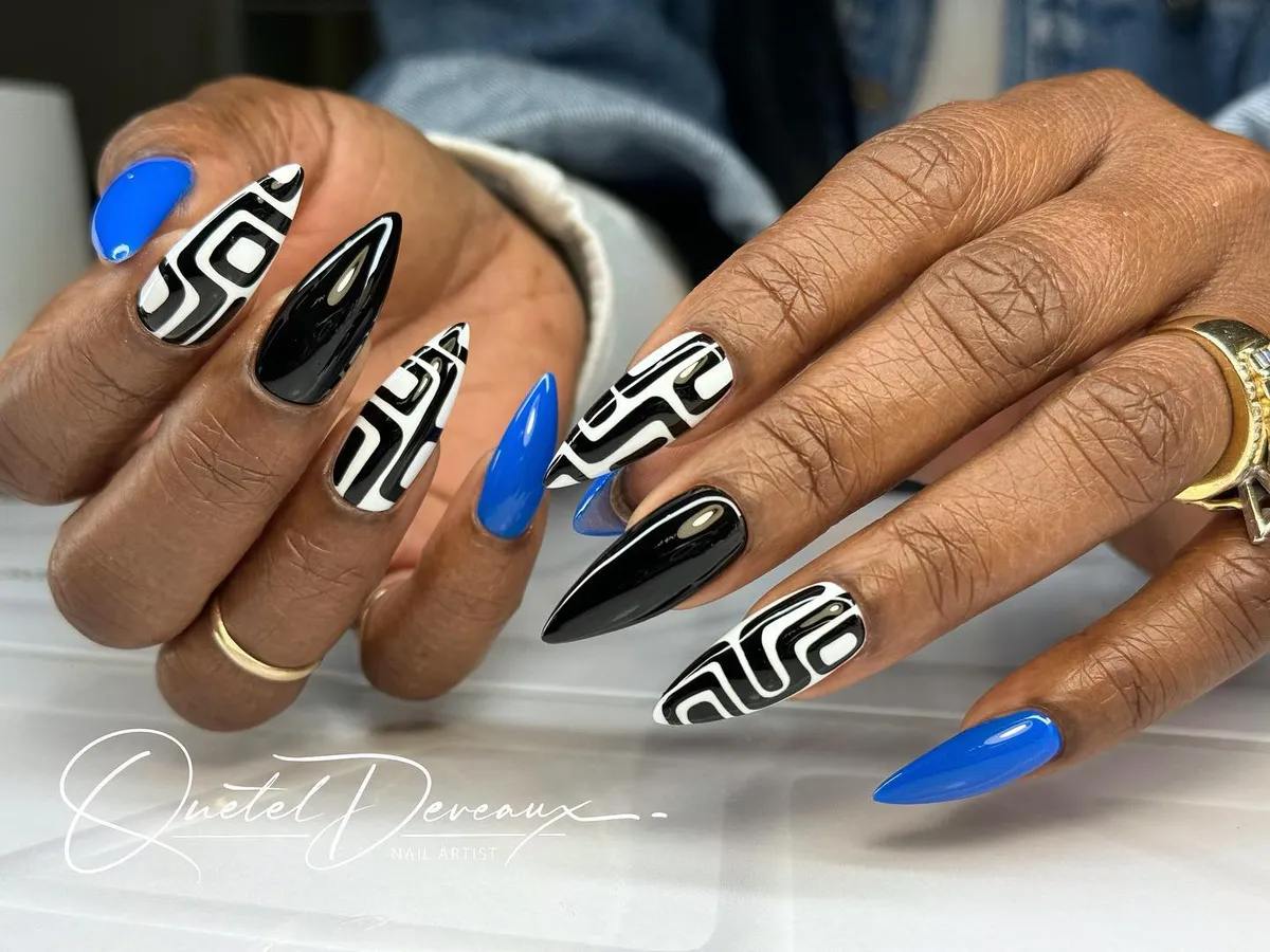 Graphic black-and-white swirls with black and blue solids