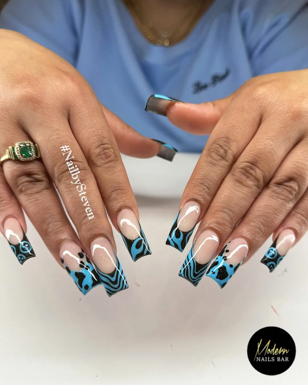 Nude base with black tips and blue graphic patterns