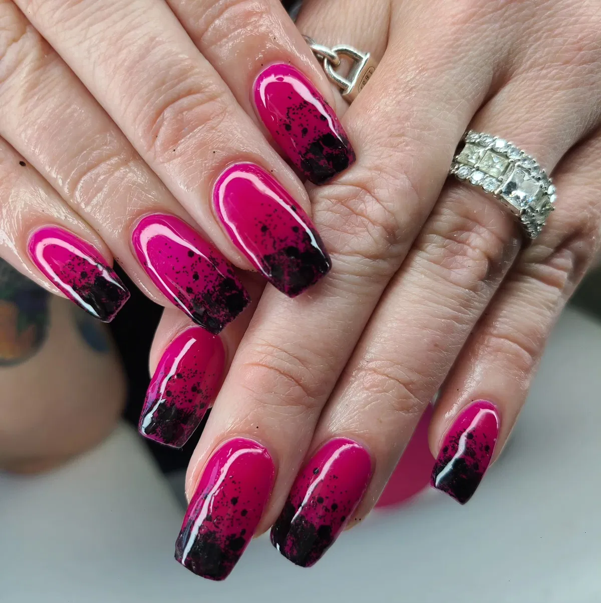 Polka-dot black French tips with 3D pink flowers