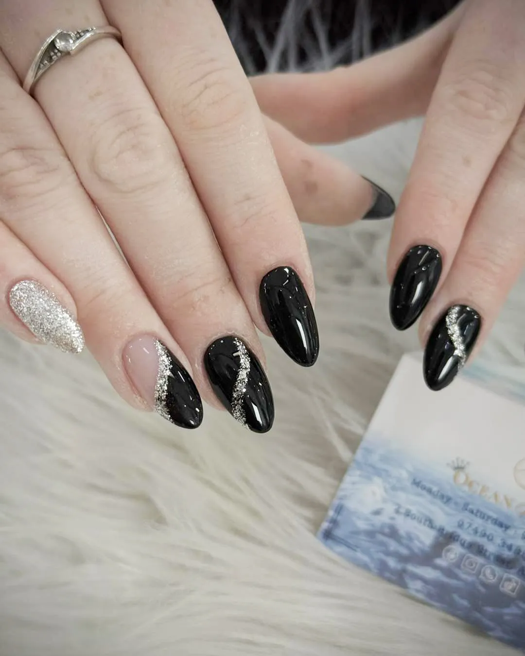 Black Nails with Diagonal Silver Glitter Accents