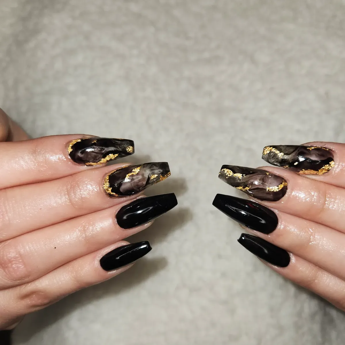 Glossy black with marbled accents and gold foil edging