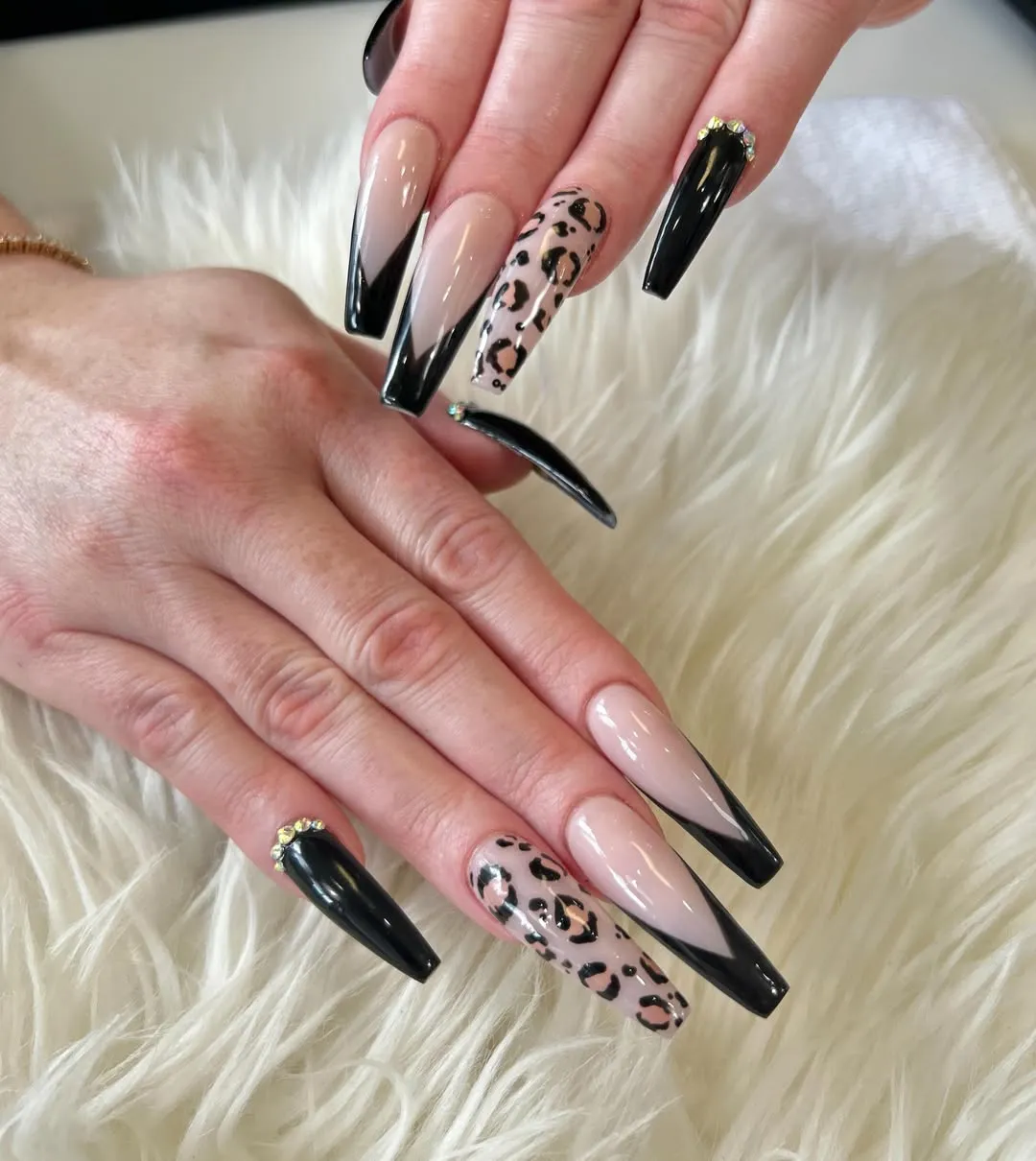 Black V-French tips with spot-print accent nails
