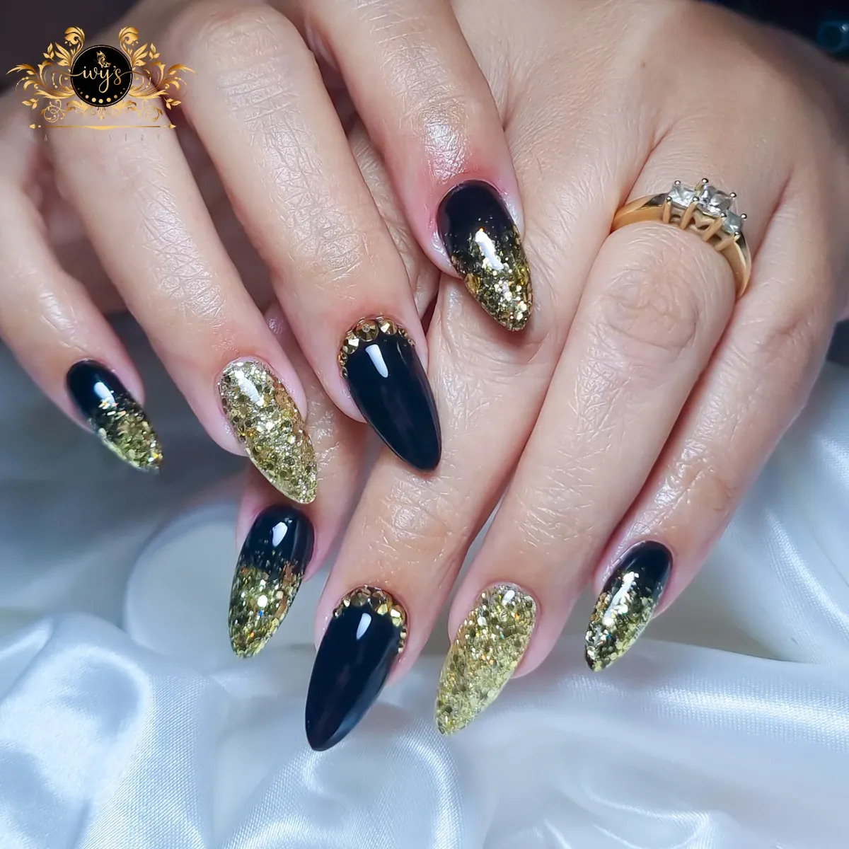Black and gold glitter gradient with studded cuticles
