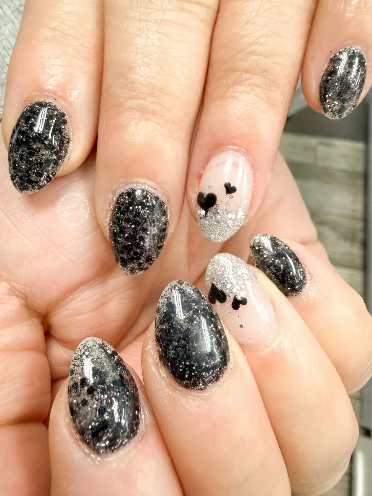Black glitter mix with heart accent nails