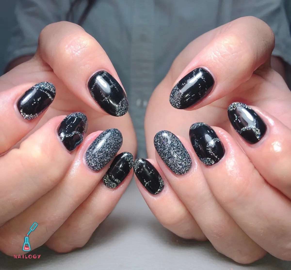 Short black nails with fine glitter tip edging