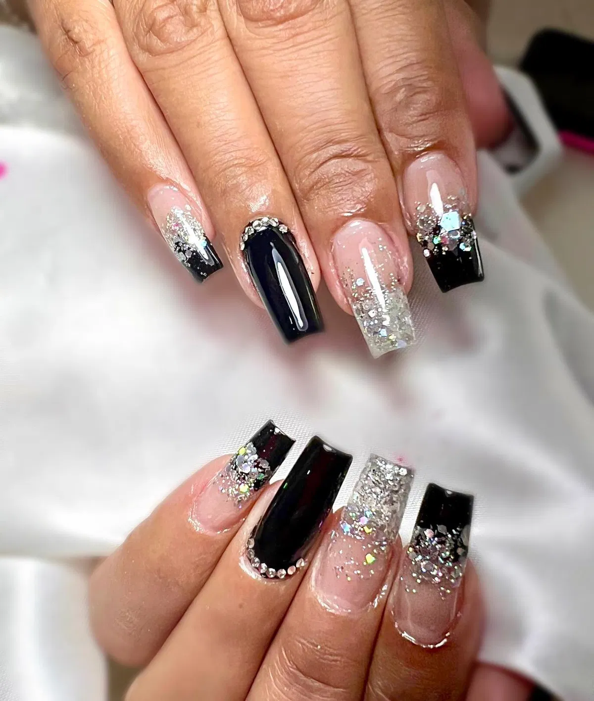 Black French tips with iridescent glitter clusters