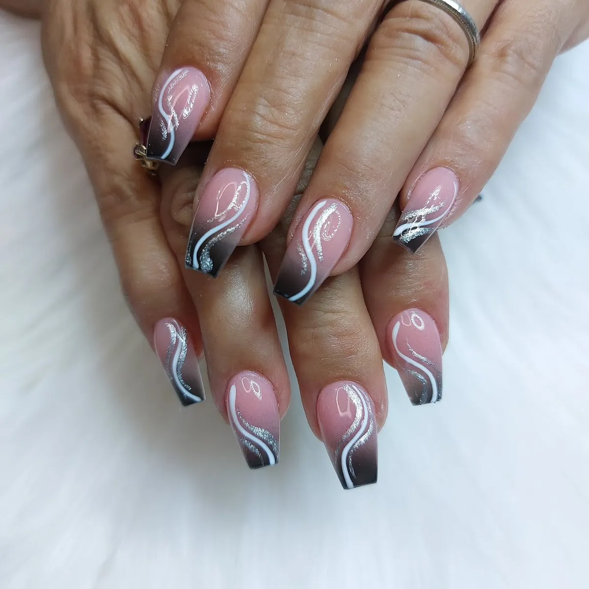 Pink-to-black ombre with white and silver swirl lines