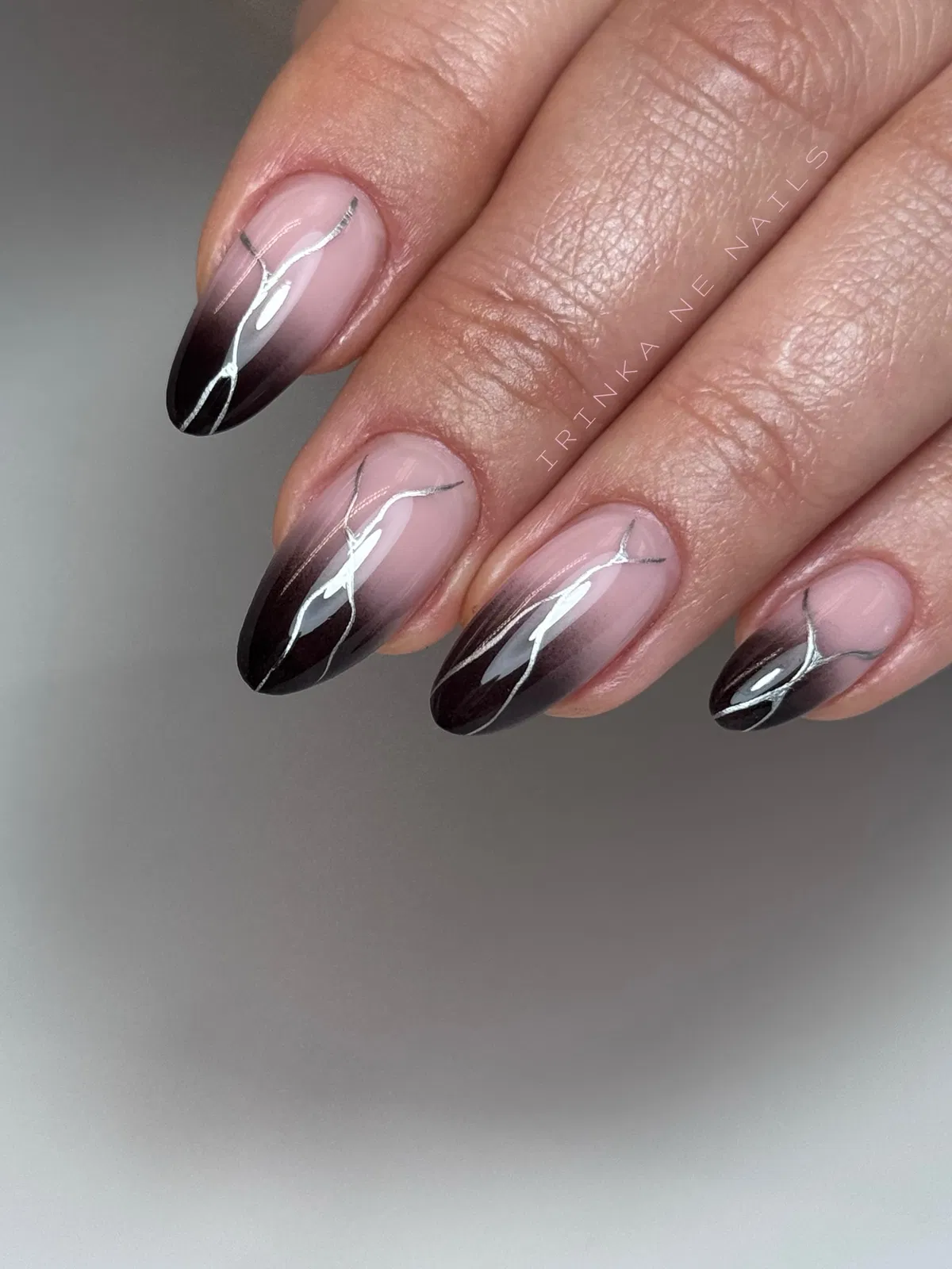 Black ombre with white curves and gold glitter striping