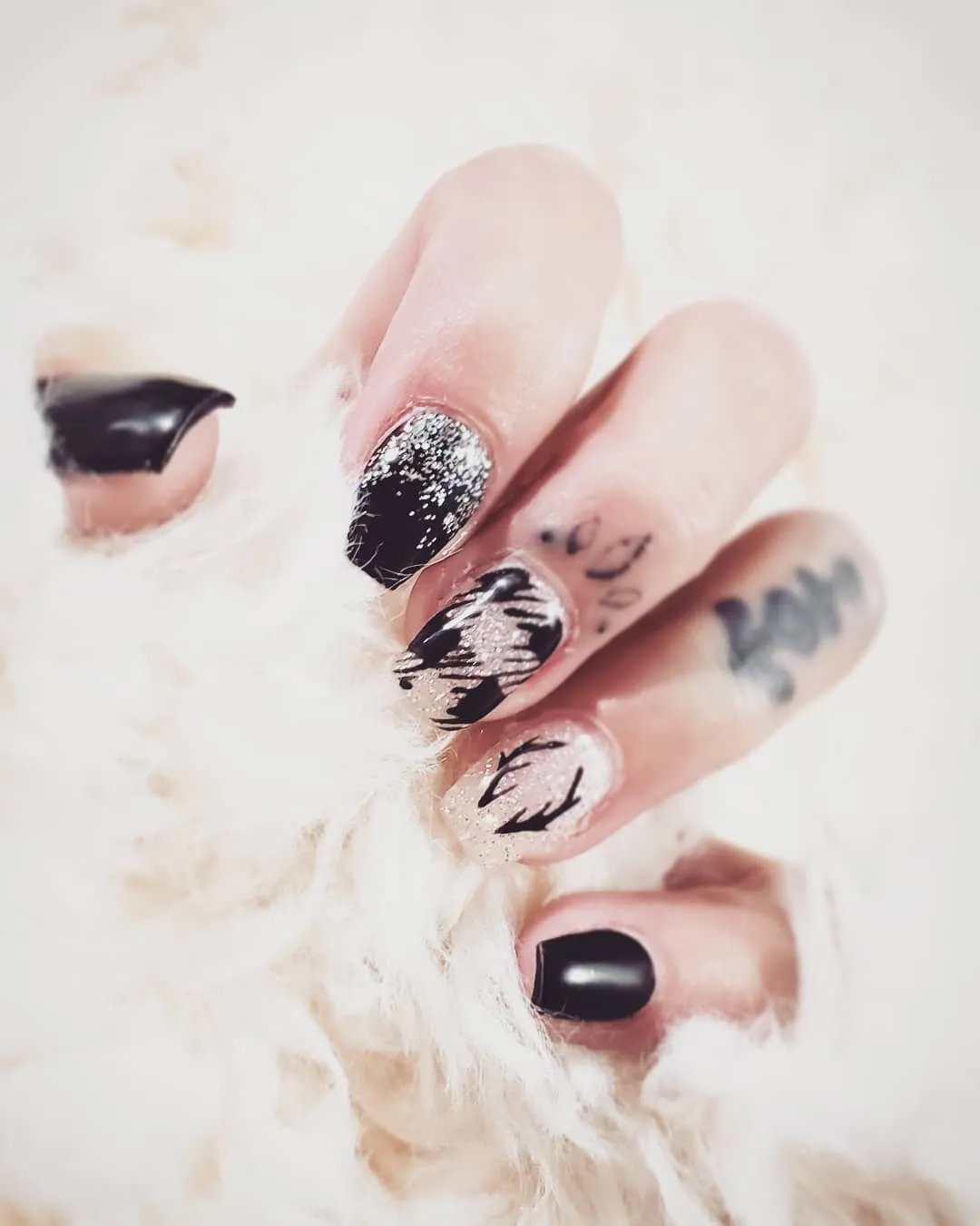 Black and silver accents with abstract black brushstroke patterns