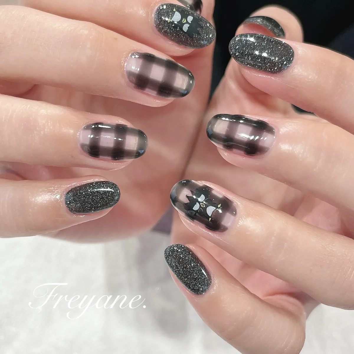 Smoky black plaid with silver glitter and small bow-like motifs