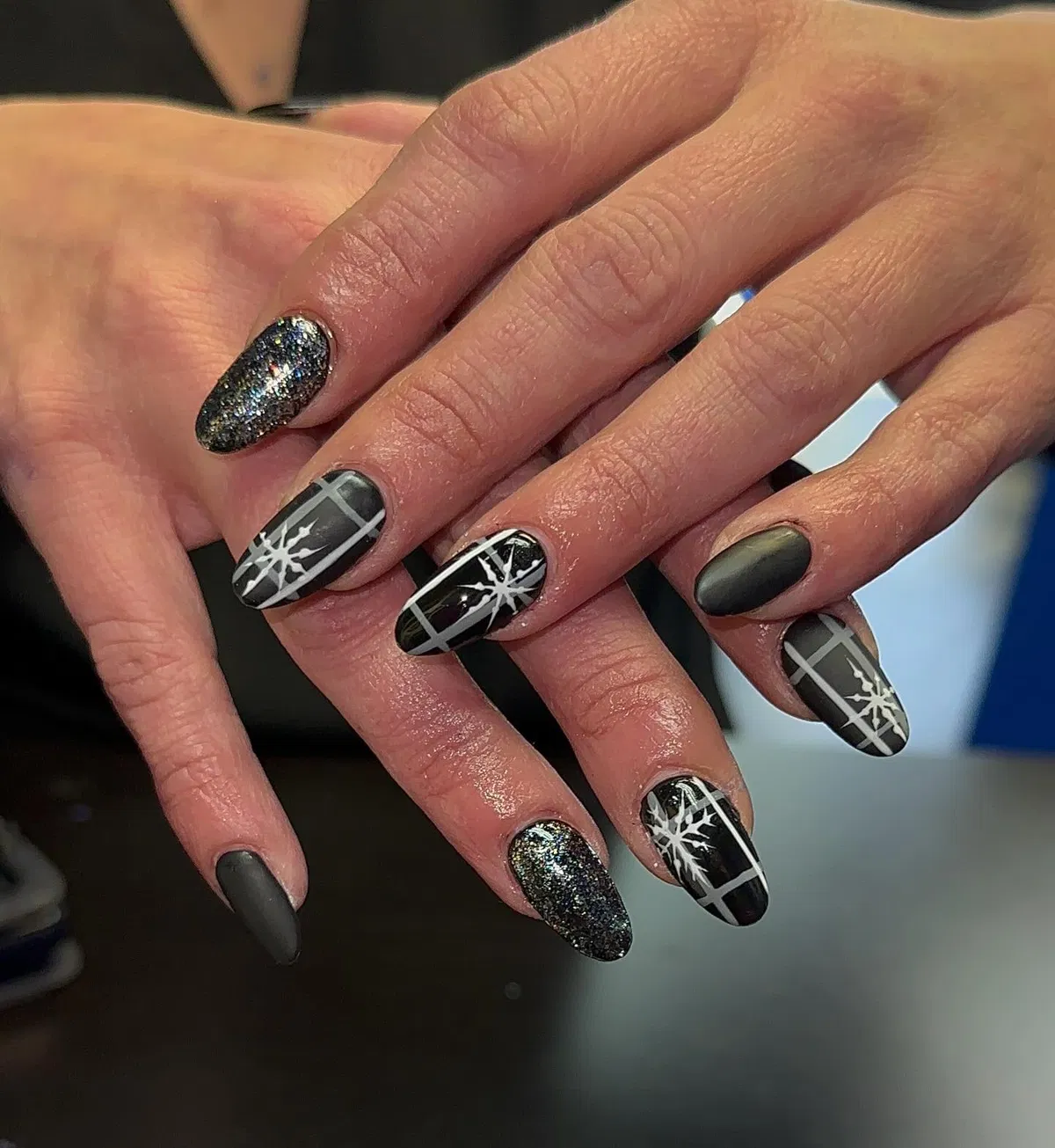 Matte gray, glitter, and glossy plaid with white starburst overlays