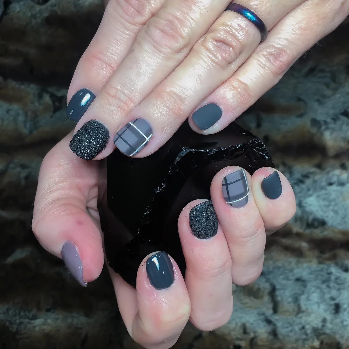 Gray-and-black plaid accents with textured black feature nails