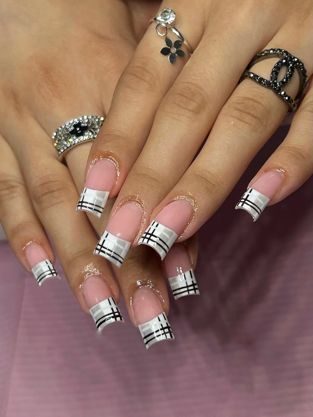 Pink base with white plaid French tips in black and gray