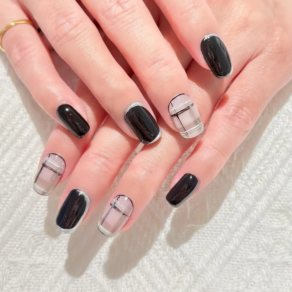 Black solids with sheer-grid plaid accents and thin edge outlines