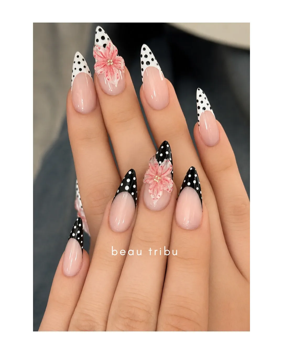 Polka-dot French tips with pink 3D flower accents