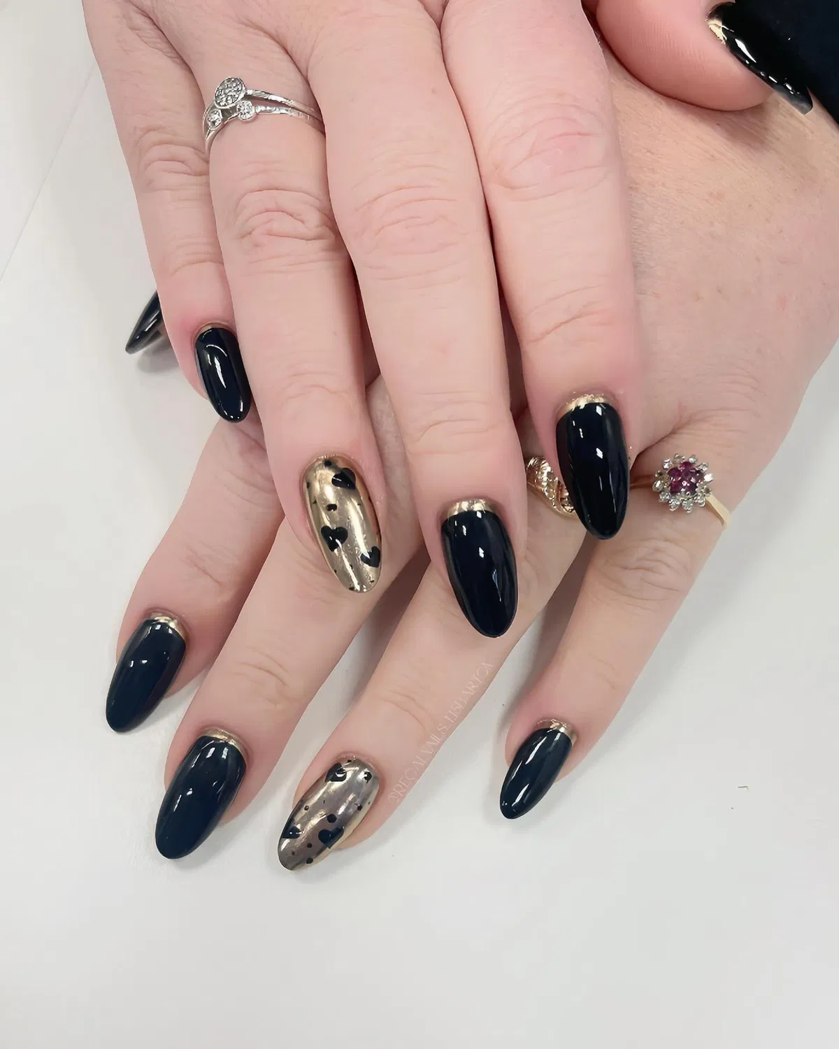 Glossy black set with metallic gold heart accent nails