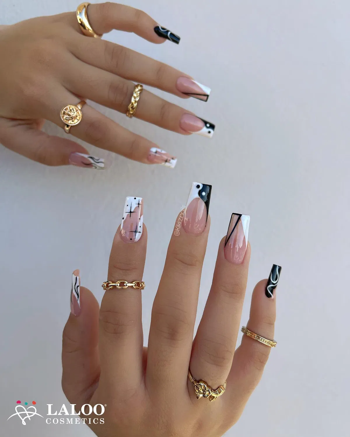 Geometric black-and-white tips over a pink base (with visible watermark text)