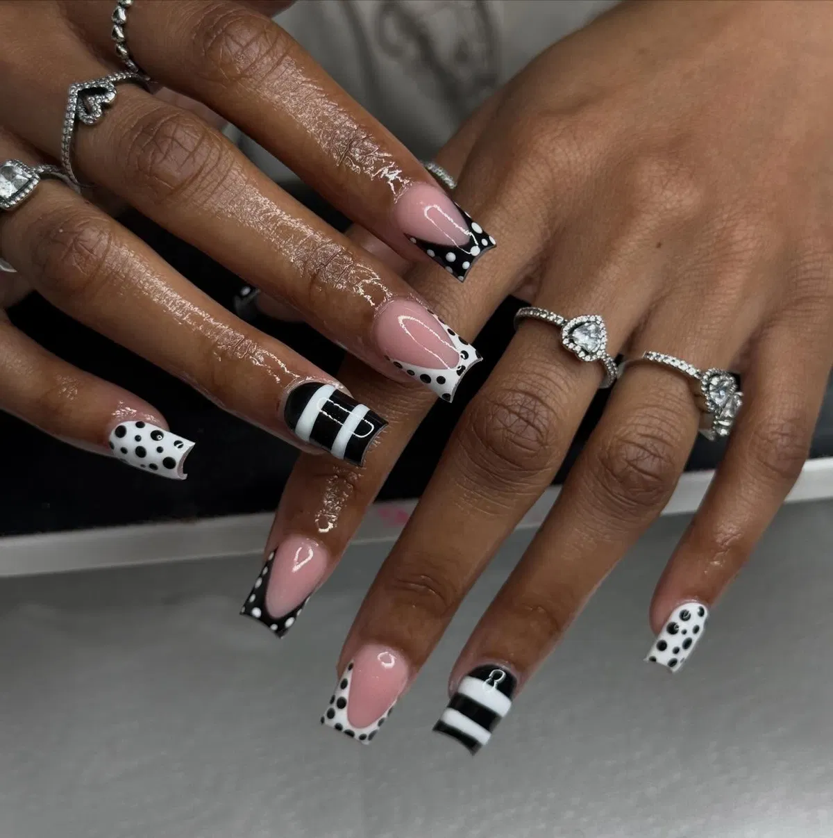 Black-and-white patterned French tips on long square nails