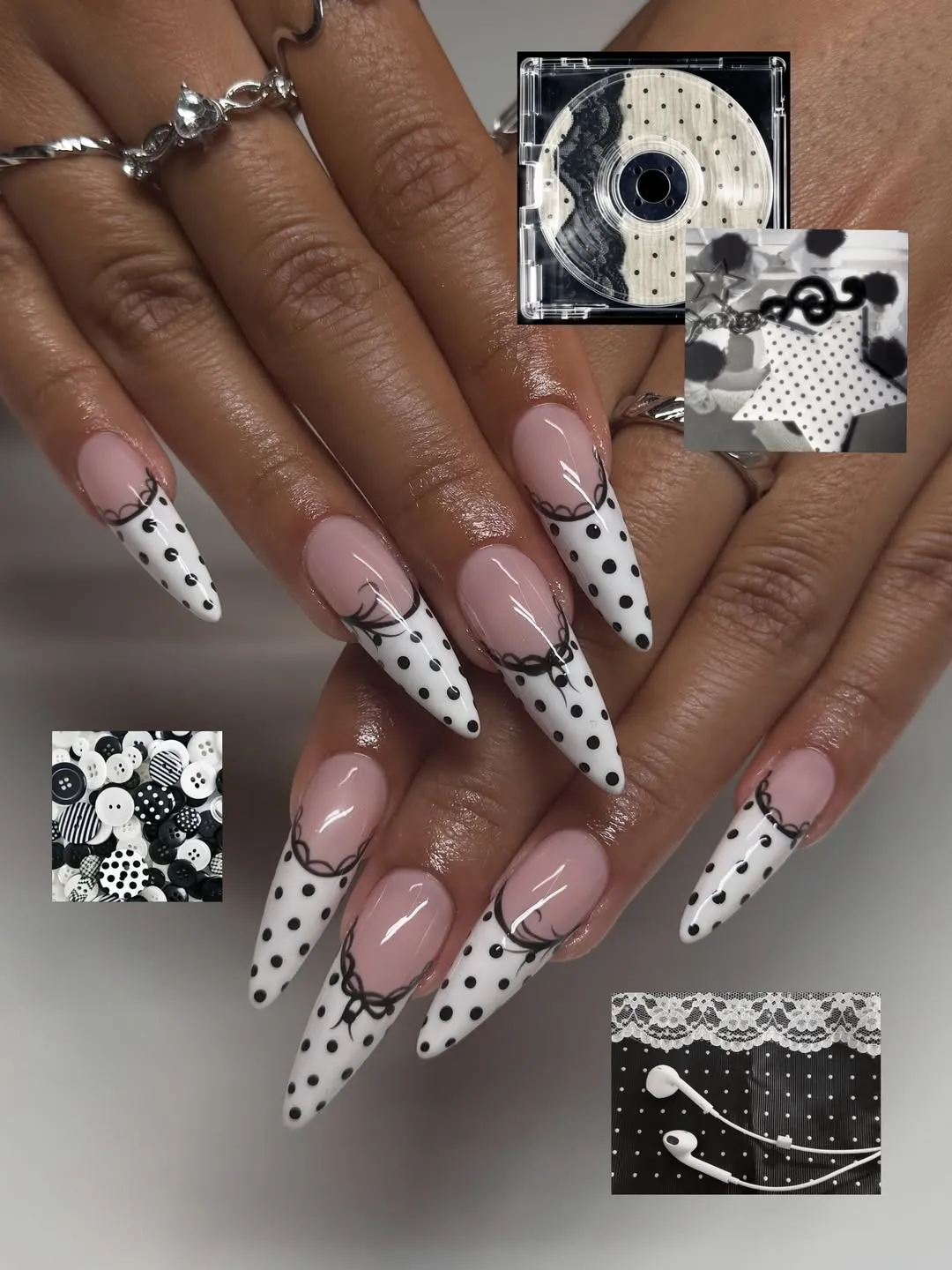 White polka-dot stiletto tips with black lace-like linework