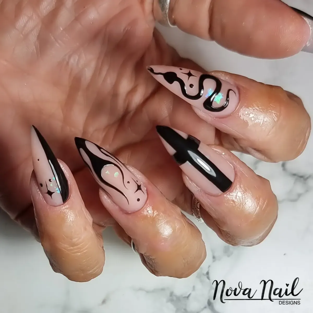Nude base with black graphic lines and star motifs